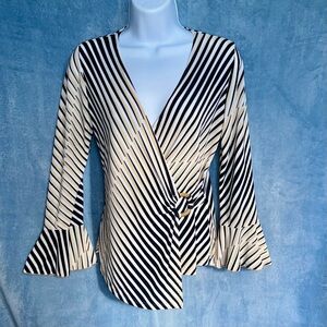 Kiwi asymmetrical faux wrap blouse with wood circle detail & ruffled cuffs